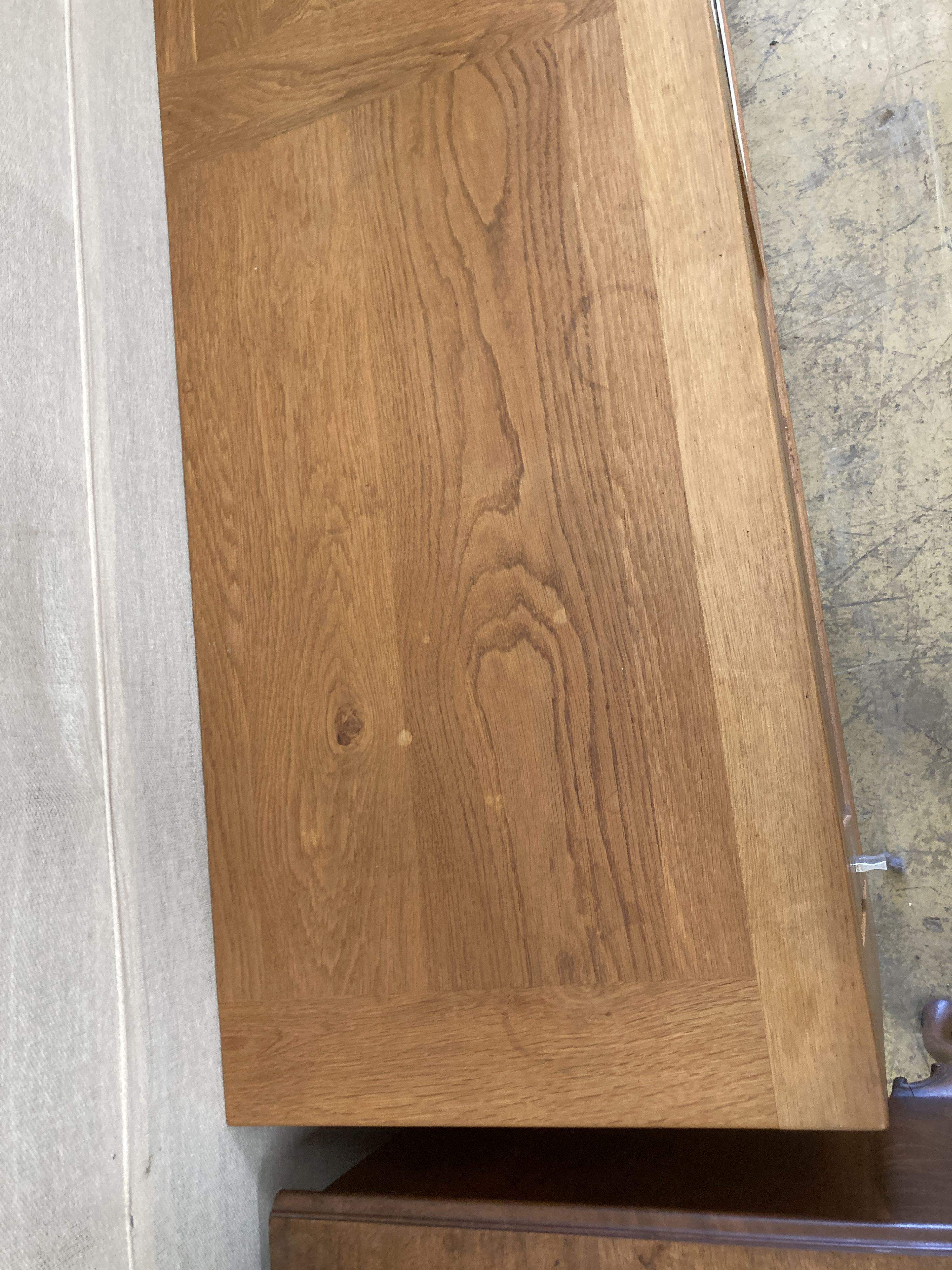 A contemporary light oak sliding door sideboard, length 178cm, depth 50cm, height 78cm